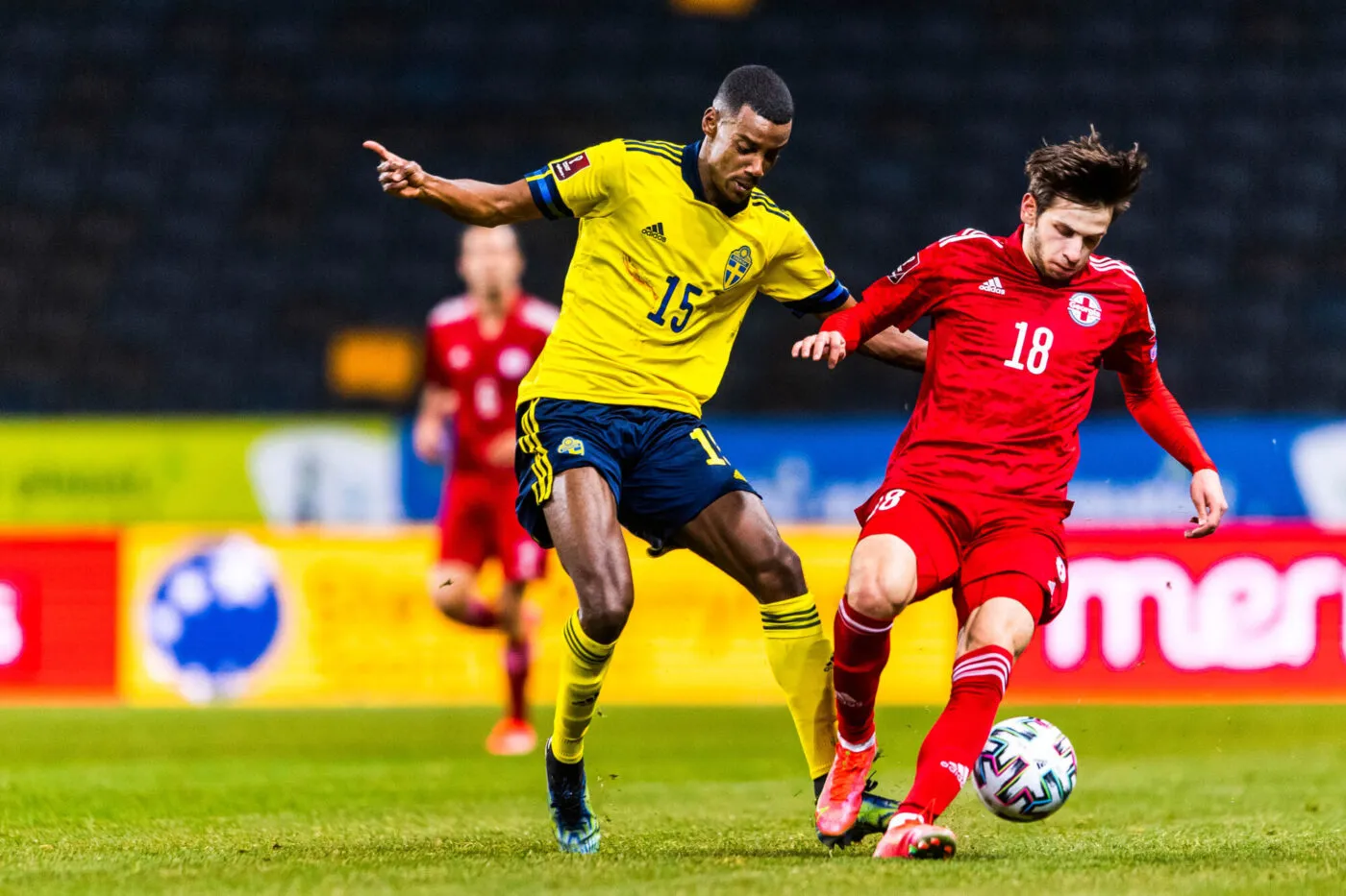 210325 Alexander Isak of Sweden and Khvicha Kvaratskhelia of Georgia during the FIFA World Cup Qualifier football match between Sweden and Georgia on March 25, 2021 in Stockholm. 