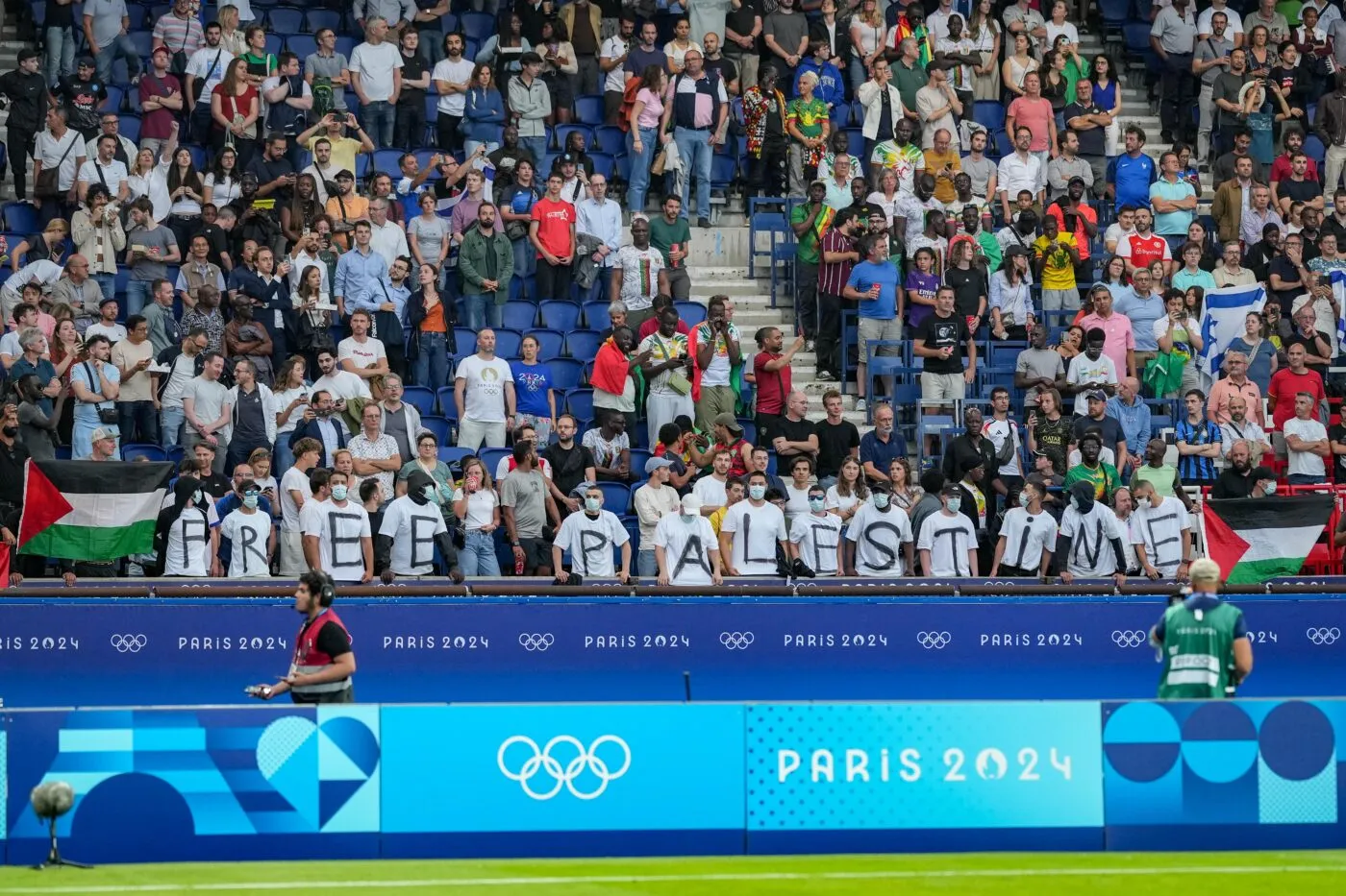 Fans protest against Israel for Free Palestine with Palestinian flag during Paris 2024 Olympic Games match between Mali U23 and Israel U23 at Parc des Princes on July 24, 2024 in Paris, France. (Photo by Pierre Costabadie/Icon Sport)   - Photo by Icon Sport